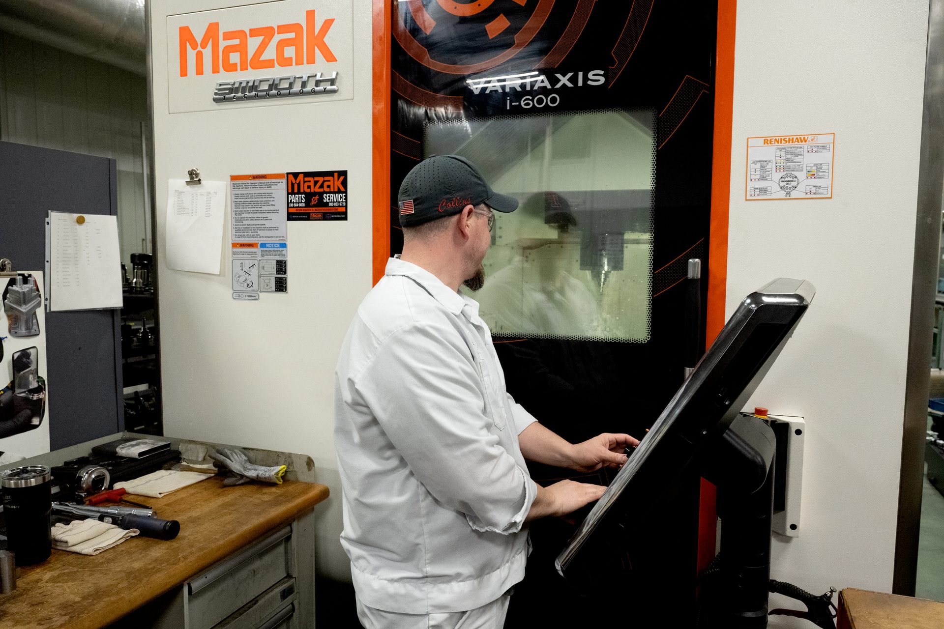 working-with-5-axis-cnc FT Precision employee working with Mazak 5-axis CNC Machine